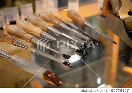 Set of carving tools, carpenter equipment on glass table - close up view 99759367