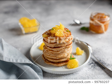 wholemeal pancakes with orange and homemade jam. 99760207