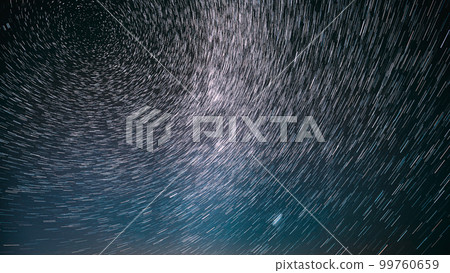 Night Starry Sky Stars And Meteoric Track Trails. Stars Rotate Of Sky Background. Spin Trails Of Stars. Large Exposure. Spin Of Stars In Sky. Unusual Stars Effect Sky. Amazing Stars Effects In Sky 99760659