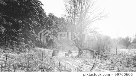 Re-enactors Dressed As World War II German Wehrmacht Infantry Soldiers Driving Old Tricar, Three-wheeled Motorcycle in Winter Snowy Forest 99760666
