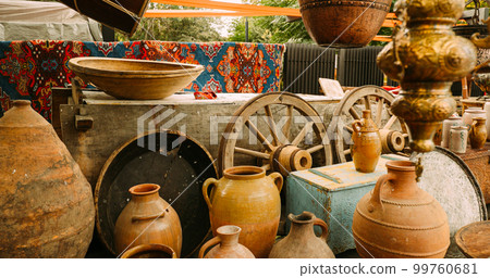 Close View Of Jugs In Shop Flea Market Of Antiques Old Retro Vintage Things. A Lot Of Old Things. Used Things. Second Hand Trading. Old Vintage Ceramic Jugs Close View Of Jugs In Shop Flea Market Of Antiques Old Retro Vintage Things. A Lot Of Old Things. Used Things. Second Hand Trading. Old Vintage Ceramic Jugs 99760681