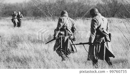 Re-enactors Dressed As German Infantry Soldiers In World War II 99760735