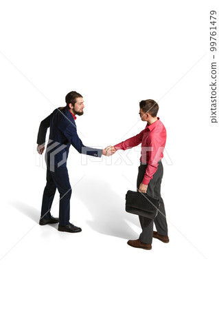 Partnership, deal. Two businessmen in official clothes shaking hands over white studio background. Isometric view. Concept of business, employment 99761479