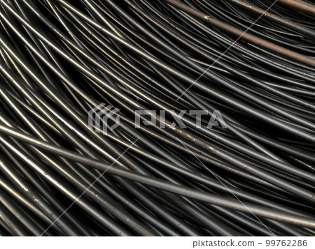 Closeup many lines of steel wire. Random focus of metallic lines 99762286