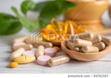 Alternative medicine herbal organic capsule with vitamin E omega 3 fish oil, mineral, drug with herbs leaf natural supplements for healthy good life. 99762997