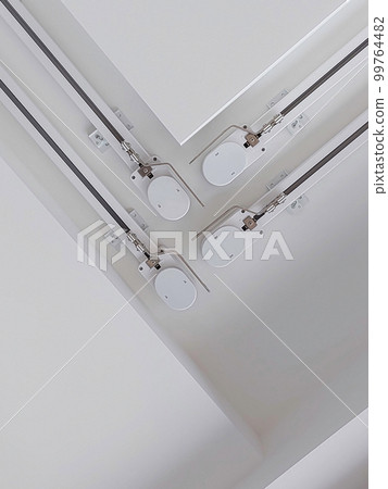 Automatic curtain rods on the ceiling. Bottom view. 99764482