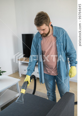 Man dry cleaner's employee hand in protective - Stock Photo [99764845] -  PIXTA