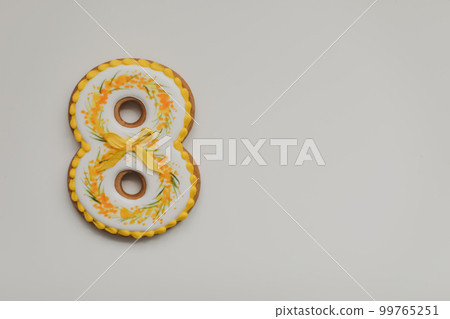 Greeting card for International Women's Day, March 8. Number 8 on white background top view, space for text. Greeting card for International Women's Day, March 8. Number 8 on white background top view, space for text. 99765251
