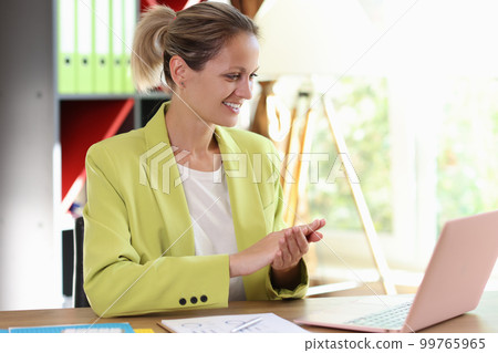 Happy smiling woman clapping in company office Happy smiling woman clapping in company office 99765965