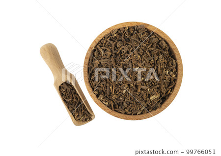 Valerian herb root in wooden bowl and scoop isolated on white background. Valeriana officinalis. used in herbal medicine as a tranquillizer and to treat insomnia, anxiety, hypertension, pain relief. 99766051