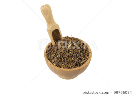 Valerian herb root in wooden bowl and scoop isolated on white background. Valeriana officinalis. used in herbal medicine as a tranquillizer and to treat insomnia, anxiety, hypertension, pain relief. 99766054