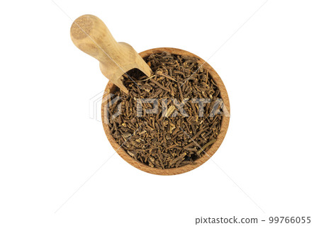 Valerian herb root in wooden bowl and scoop isolated on white background. Valeriana officinalis. used in herbal medicine as a tranquillizer and to treat insomnia, anxiety, hypertension, pain relief. 99766055