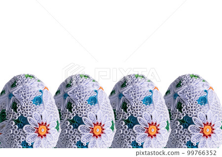 Four Easter eggs one next to the other with a floral pattern appear on a white background. Four Easter eggs one next to the other with a floral pattern appear on a white background. 99766352