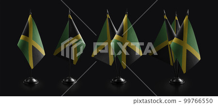 Small national flags of the Jamaica on a black background Small national flags of the Jamaica on a black background 99766550