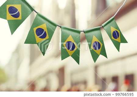 A garland of Brazil national flags on an abstract blurred background 99766595
