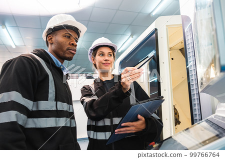 Engineer working in robotics factory Engineer working in robotics factory 99766764