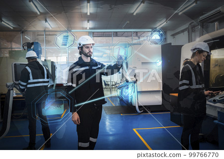 Engineer working in robotics factory 99766770