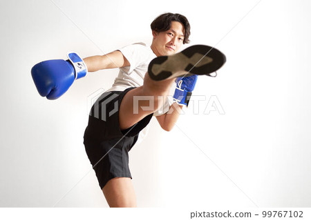 Young man doing kickboxing training boxercise image 99767102