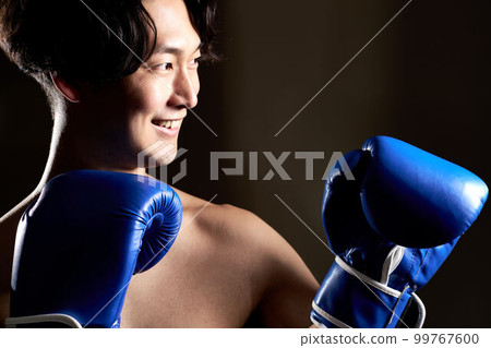 Young man wearing boxing gloves Training Boxercise image 99767600