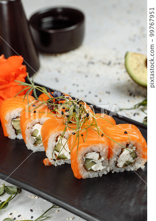 Sushi Philadelphia on a stone decorative plate 99767951