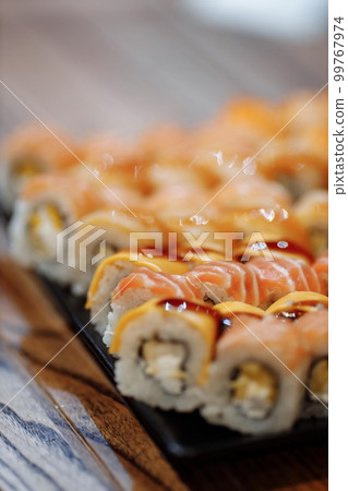 Rainbow Sushi set with salmon, eel, tuna, avocado, royal prawn, cream cheese Philadelphia, caviar tobica, chuka. Sushi menu. Japanese food Rainbow Sushi set with salmon, eel, tuna, avocado, royal prawn, cream cheese Philadelphia, caviar tobica, chuka. Sushi menu. Japanese food 99767974