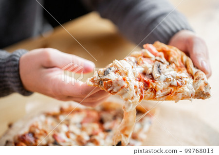 one people taking slices of pizza out of the box. fast delivery of food. packaging for fast food. top view one people taking slices of pizza out of the box. fast delivery of food. packaging for fast food. top view 99768013