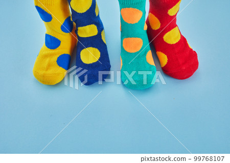 World Down syndrome day background. Legs with different socks as symbol of down syndrome 99768107