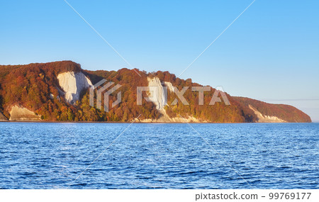 Baltic Sea coast with Rugen Island chalk cliffs at sunrise, Germany. 99769177