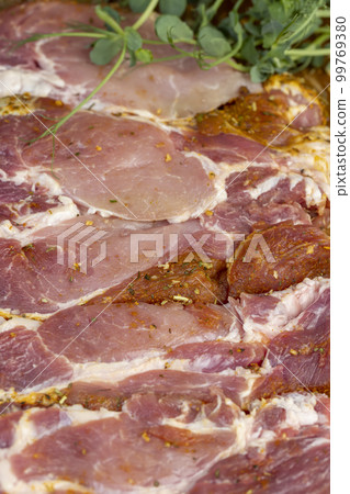 Sliced and pickled with spices and salt Sliced and pickled with spices and salt 99769380