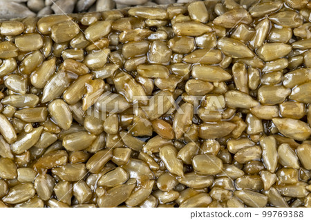 Fried sunflower seeds with sweet molasses from sugar beet Fried sunflower seeds with sweet molasses from sugar beet 99769388