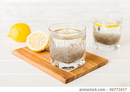 Healthy breakfast or morning with chia seeds and lemon on table background, vegetarian food, diet and health concept. Chia pudding with lemon 99771657