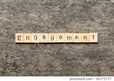 engagement word written on wood block. engagement text on table, concept 99771777