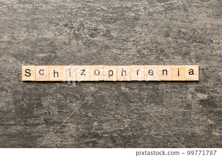 schizophrenia word written on wood block. schizophrenia text on table, concept 99771787