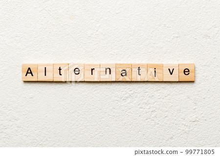 alternative word written on wood block. alternative text on table, concept 99771805