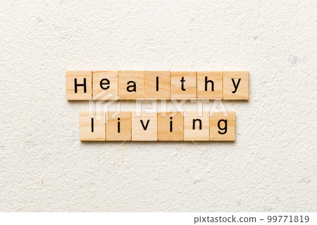 Healthy Living word written on wood block. Healthy Living text on cement table for your desing, concept 99771819