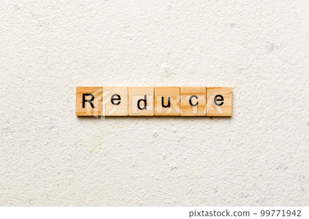reduce word written on wood block. reduce text on cement table for your desing, concept reduce word written on wood block. reduce text on cement table for your desing, concept 99771942