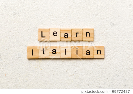 learn italian word written on wood block. learn italian text on table, concept 99772427