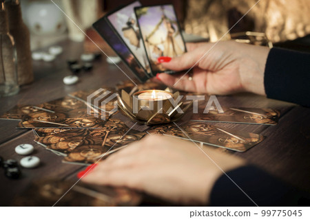 Blurred tarot cards on the table, esoteric concept, fortune telling predictions 99775045