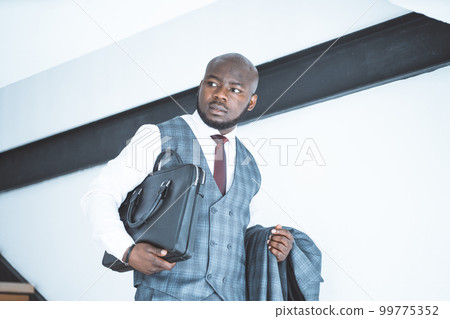 Chief Director is in a Hurry to Meet with Investors. Successful Manager Starts his Working Day. Close-up Portrait. High quality photo Chief Director is in a Hurry to Meet with Investors. Successful Manager Starts his Working Day. Close-up Portrait. High quality photo 99775352