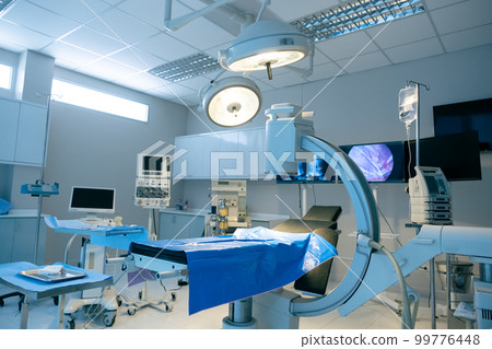 Empty operating room with bed 99776448