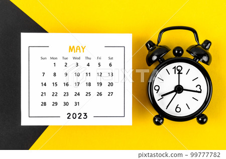 The May 2023 Monthly calendar for 2023 year with black colour alarm clock on beautiful background. 99777782