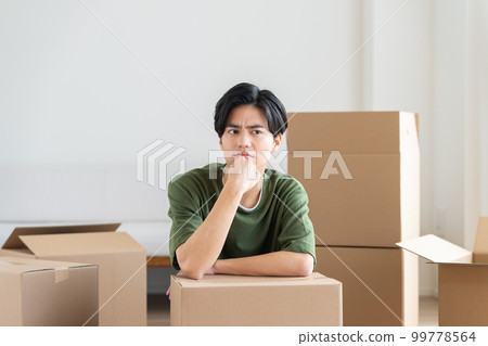 A young man worried about moving A young man worried about moving 99778564