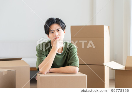 A young man worried about moving 99778566