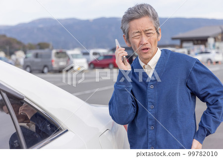 Senior man who causes an accident and contacts the police and fire department Senior man who causes an accident and contacts the police and fire department 99782010