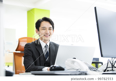 Office businessman laptop computer smile looking at camera 99782553
