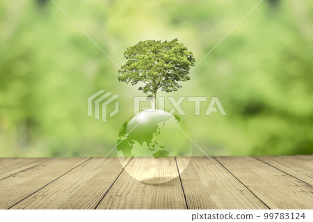 Earth and growing trees on forest background. Earth and growing trees on forest background. 99783124