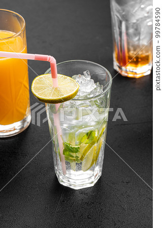 Different glasses with assorted cocktails 99784590