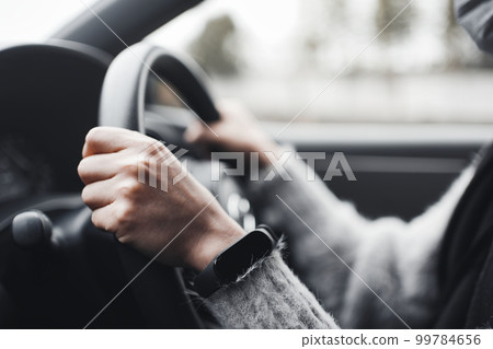 Women's woman driving a car 99784656