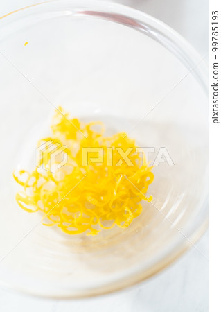 Close up view. Filling mascarpone tart with cheese filling and decorating with fresh berries. Close up view. Filling mascarpone tart with cheese filling and decorating with fresh berries. 99785193