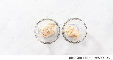 Flat lay. Mixing into the bread dough red and blue food coloring to bake patriotic cinnamon twists. Flat lay. Mixing into the bread dough red and blue food coloring to bake patriotic cinnamon twists. 99785239